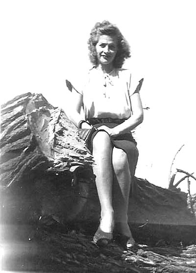 Eleanor Vaden sitting on a fallen trunk