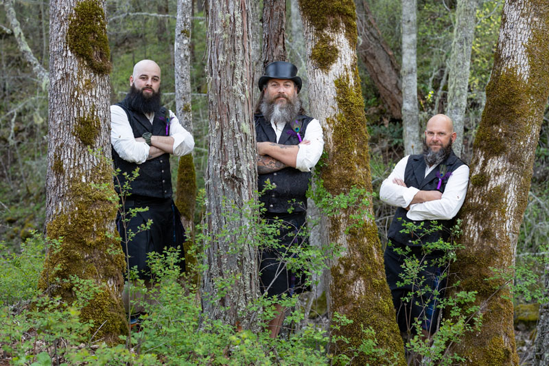 Groom and groomsmen at the edge of the forest